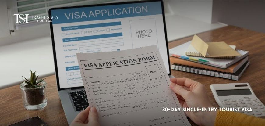 Indian traveller holding a passport and Dubai tourist visa approval for a UAE vacation.
