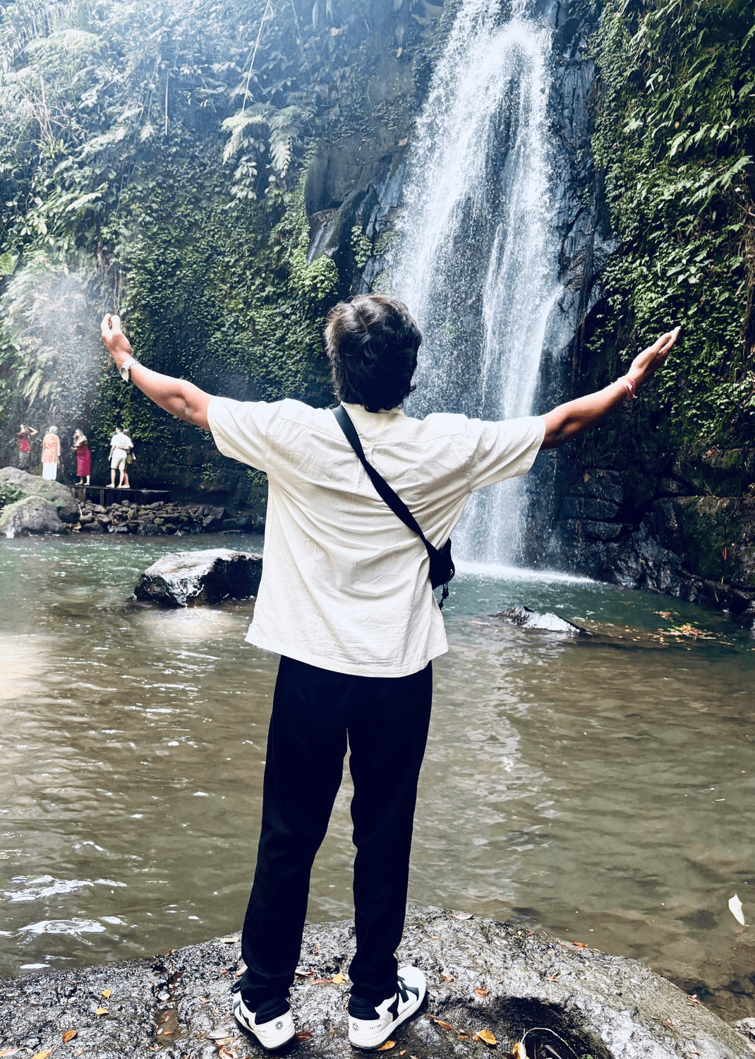 Harshit Sharma exploring a beautiful waterfall during his Bali holiday from India